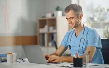 Healthcare Professional using a laptop 