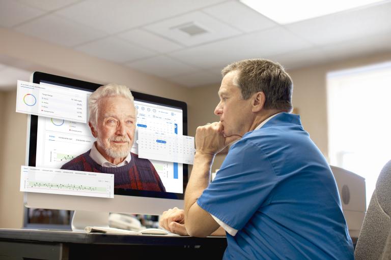 Male doctor personalizing care and treatment plan through virtual web application